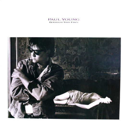 PAUL YOUNG - BETWEEN TWO FIRES - VINYL